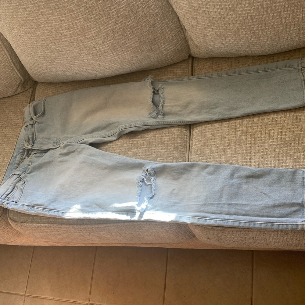 Light blue ripped jeans